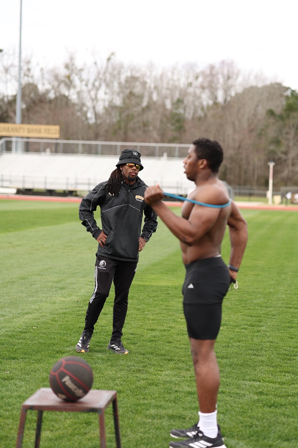Coach Kendrick training an athlete in NC
